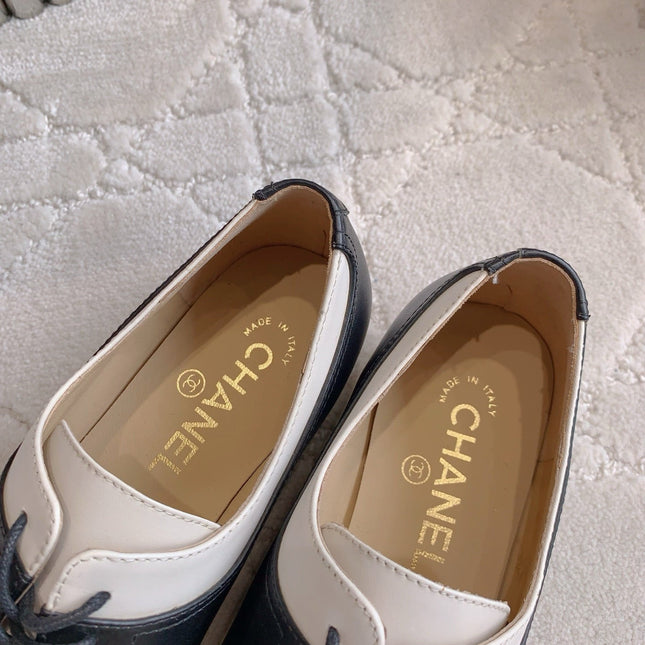 CHANEL 25S TWO TONE LACE UP IN BLACK AND WHITE CALFSKIN