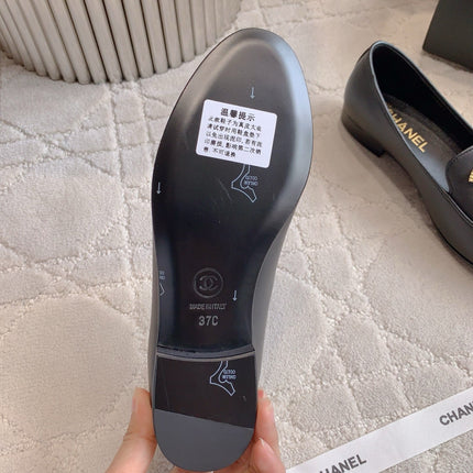 CHANEL 25S LOAFERS WITH LARGE LOGO IN BLACK CALFSKIN GOLD HARDWARE