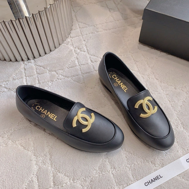 CHANEL 25S LOAFERS WITH LARGE LOGO IN BLACK CALFSKIN GOLD HARDWARE