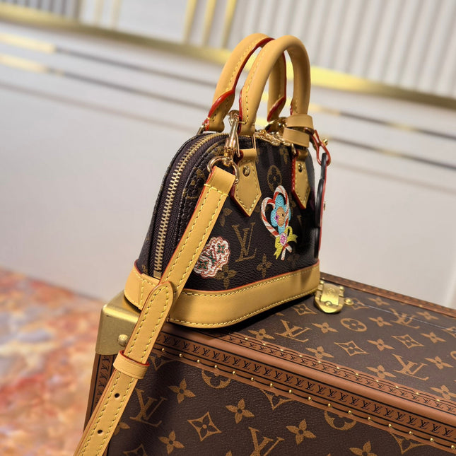 LV 25S NANO ALMA 18 IN BROWN MONOGRAM CANVAS PRINTED WITH THE VIVIENNE MASCOT