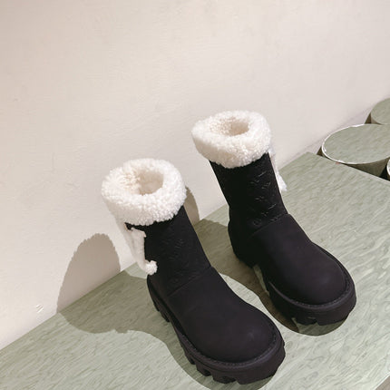 ANKLE BOOTS IN BLACK EMBOSSED CALFSKIN AND WHITE SHEARLING