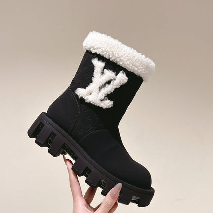 ANKLE BOOTS IN BLACK EMBOSSED CALFSKIN AND WHITE SHEARLING