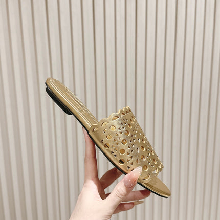 ALAIA PERFORATED SLIDE SANDALS 25S IN LIGHT GOLD LAMBSKIN