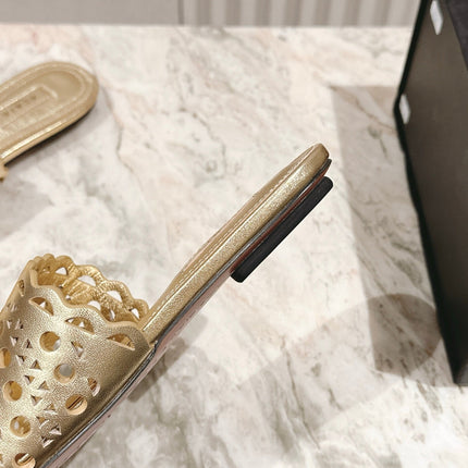 ALAIA PERFORATED SLIDE SANDALS 25S IN LIGHT GOLD LAMBSKIN