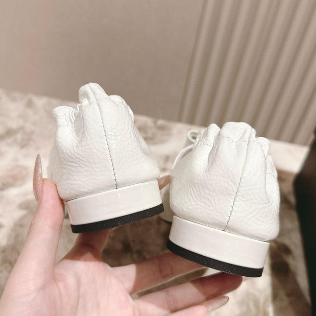 CC FLATS 25S IN WHITE PATENT LEATHER