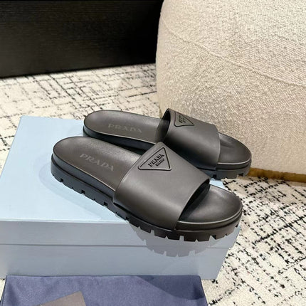 PRADA 25S RUBBER SLIDE IN CHARCOAL CALFSKIN WITH LOGO