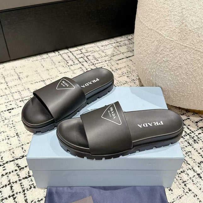 PRADA 25S RUBBER SLIDE IN BLACK CALFSKIN WITH LOGO