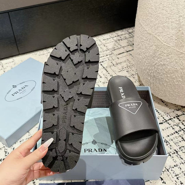 PRADA 25S RUBBER SLIDE IN BLACK CALFSKIN WITH LOGO
