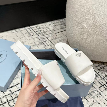 PRADA 25S PADDED SLIDES IN WHITE CALFSKIN WITH LOGO