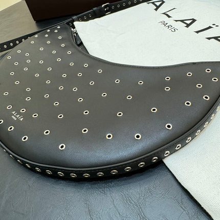 ONE PIECE DEMI LUNE BAG 31 IN BLACK SHEEPSKIN EYELET DETAILING