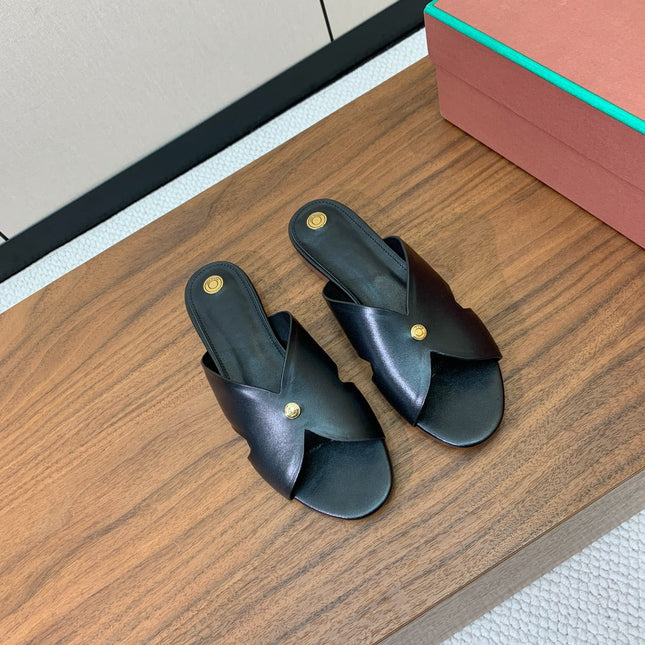 FLAT SLIPPERS IN BLACK CALFSKIN