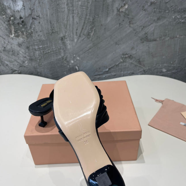 HIGH - HEEL BLACK SHEEPSKIN WITH STYLIZED STRAPS