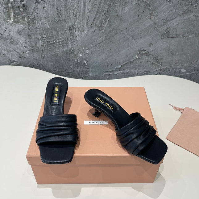 HIGH - HEEL BLACK SHEEPSKIN WITH STYLIZED STRAPS