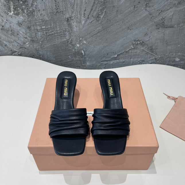 HIGH - HEEL BLACK SHEEPSKIN WITH STYLIZED STRAPS