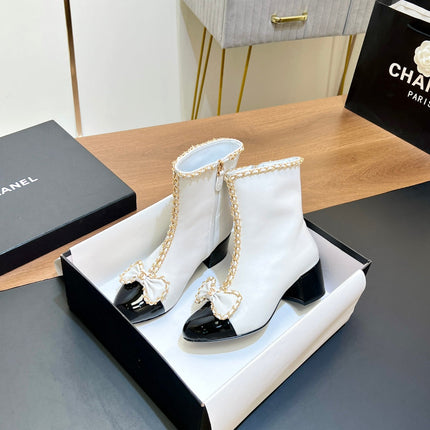 CHANEL 25S HEELED CHAIN BOOTS WITH BOW IN WHITE CALFSKIN GOLD HARDWRE