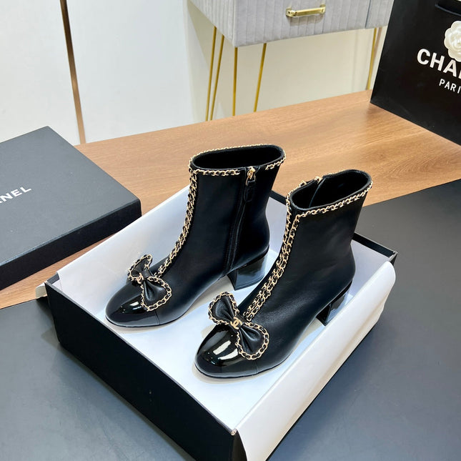 CHANEL 25S HEELED CHAIN BOOTS WITH BOW IN BLACK CALFSKIN GOLD HARDWRE