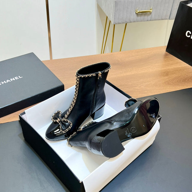 CHANEL 25S HEELED CHAIN BOOTS WITH BOW IN BLACK CALFSKIN GOLD HARDWRE