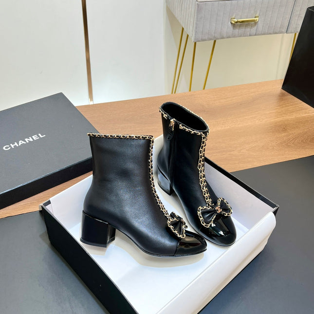 CHANEL 25S HEELED CHAIN BOOTS WITH BOW IN BLACK CALFSKIN GOLD HARDWRE