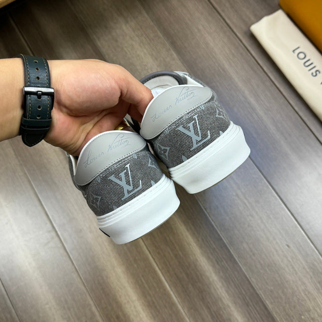 LV TRAINER SNEAKER IN GREY PASTEL MONOGRAM DENIM