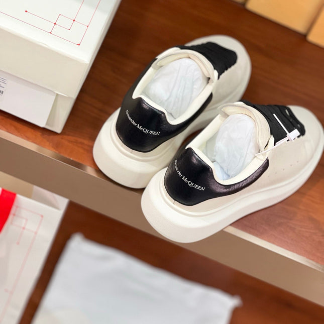 OVERSIZED SNEAKERS IN WHITE CALFSKIN BLACK HEEL BLACK LACES