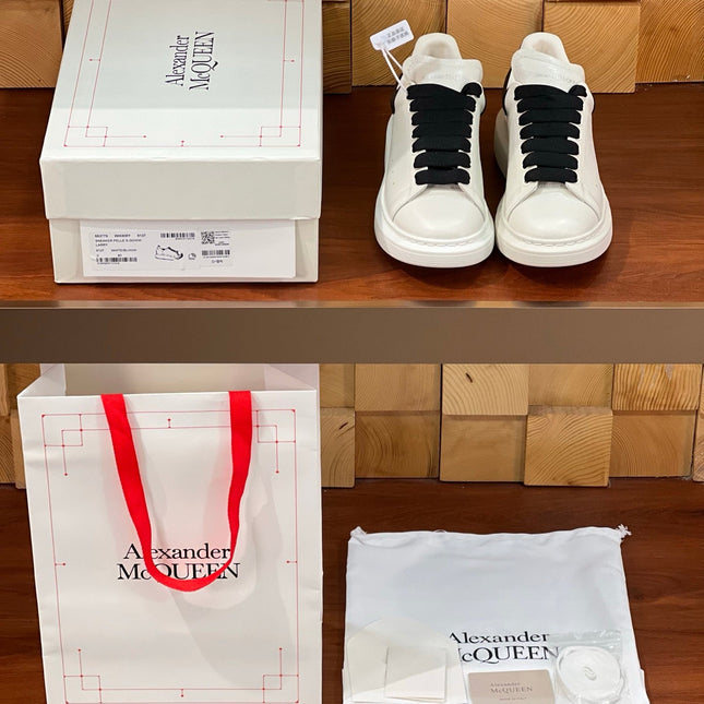 OVERSIZED SNEAKERS IN WHITE CALFSKIN BLACK HEEL BLACK LACES