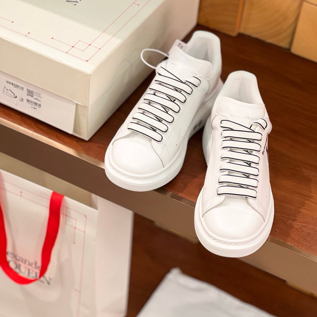 OVERSIZED SNEAKERS IN WHITE CALFSKIN CARTOON FIGURE BLACK TRIM LACES