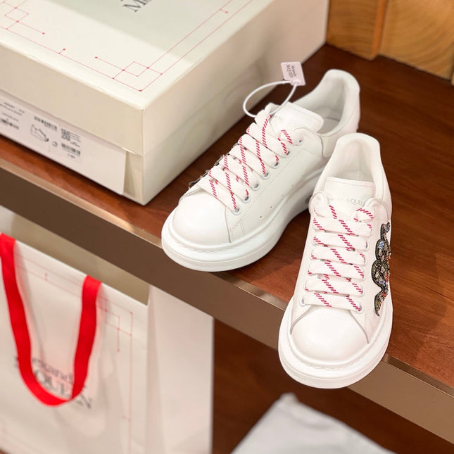 OVERSIZED SNEAKERS IN WHITE CALFSKIN EMBROIDERED CRYSTAL SNAKE