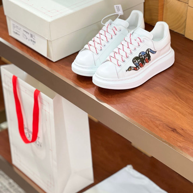 OVERSIZED SNEAKERS IN WHITE CALFSKIN EMBROIDERED CRYSTAL SNAKE