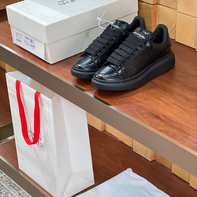 OVERSIZED SNEAKERS IN BLACK GLOSSY CALFSKIN SNAKE-EFFECT