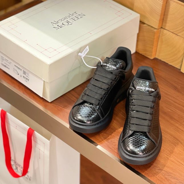 OVERSIZED SNEAKERS IN BLACK GLOSSY CALFSKIN SNAKE-EFFECT