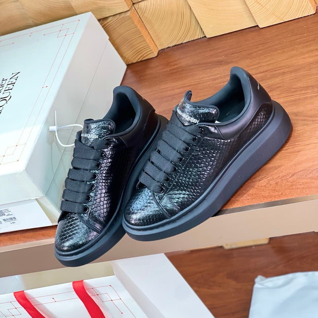 OVERSIZED SNEAKERS IN BLACK GLOSSY CALFSKIN SNAKE-EFFECT