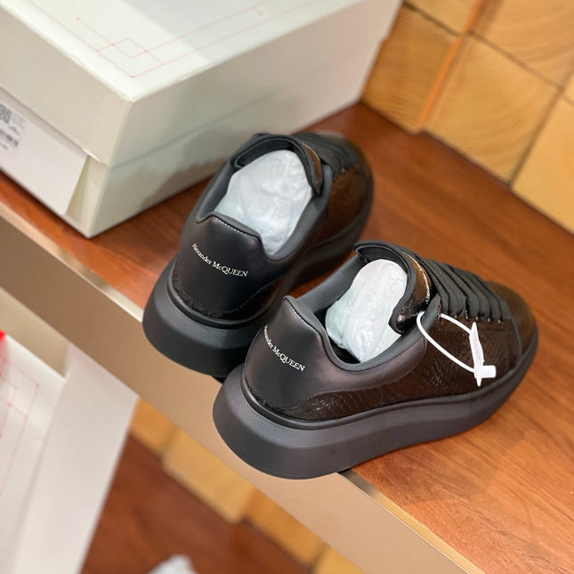 OVERSIZED SNEAKERS IN BLACK GLOSSY CALFSKIN SNAKE-EFFECT