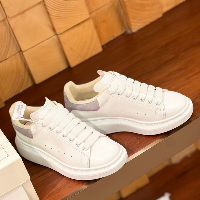 OVERSIZED SNEAKERS IN WHITE CALFSKIN WITH THISTLE PURPLE SUEDE HEEL TAB