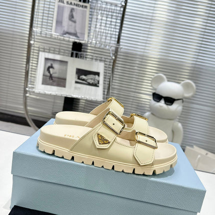 PRADA 25S STRAP SLIDES 30MM IN CREAM CALFSKIN GOLD HARDWARE