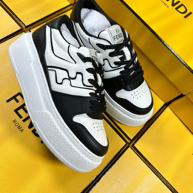 FENDI THICK-SOLDED SNEAKER IN WHITE AND BLACK LAMBSKIN