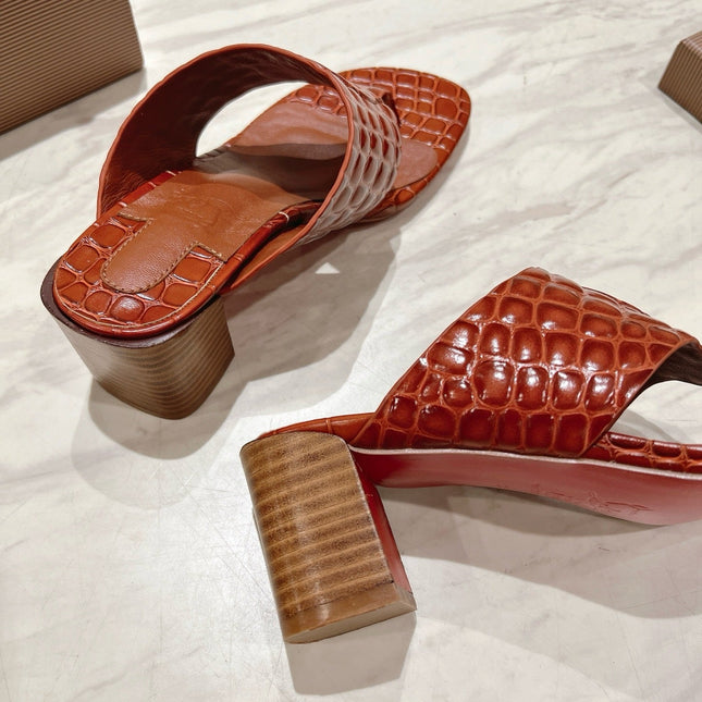 EMBOIDERED LOGO MULES IN COGNAC BROWN EMBOSSED CALFSKIN
