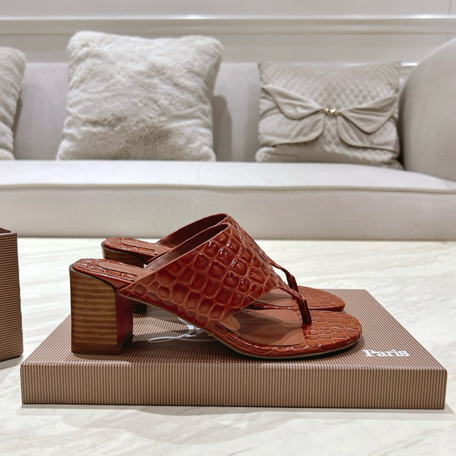 EMBOIDERED LOGO MULES IN COGNAC BROWN EMBOSSED CALFSKIN