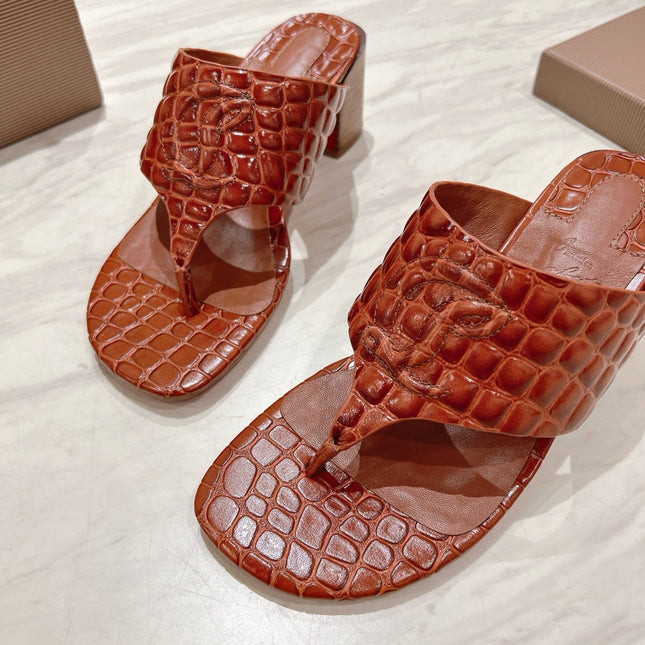 EMBOIDERED LOGO MULES IN COGNAC BROWN EMBOSSED CALFSKIN