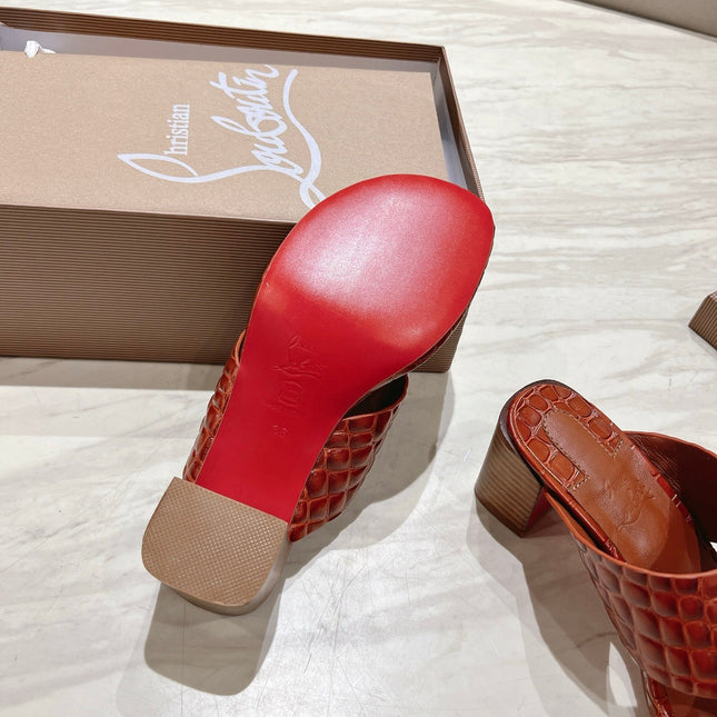 EMBOIDERED LOGO MULES IN COGNAC BROWN EMBOSSED CALFSKIN