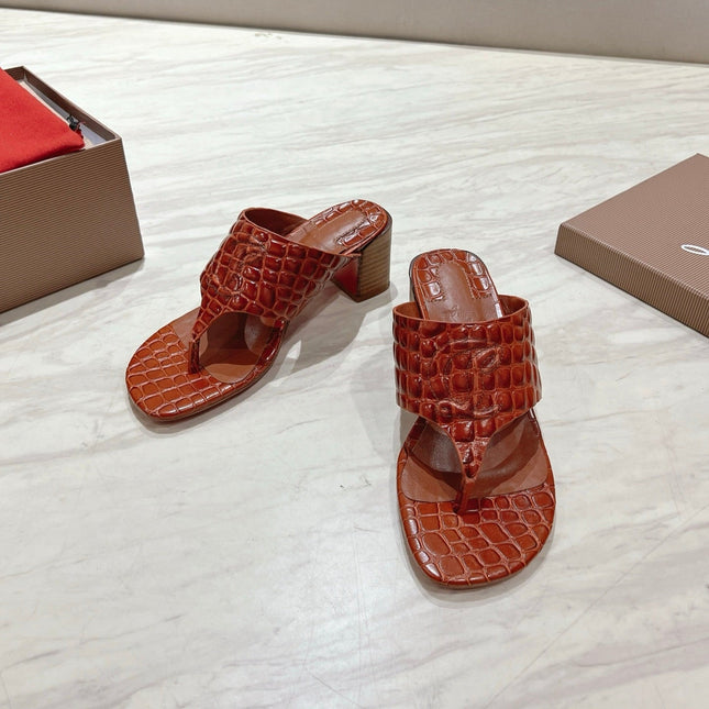 EMBOIDERED LOGO MULES IN COGNAC BROWN EMBOSSED CALFSKIN