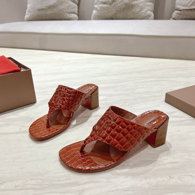 EMBOIDERED LOGO MULES IN COGNAC BROWN EMBOSSED CALFSKIN