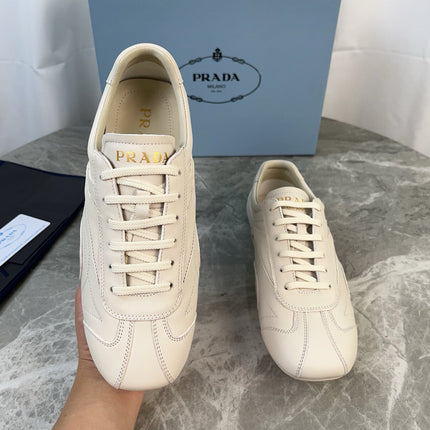 PRADA 25S MONTECARLO ANTIQUED SNEAKERS IN CHALK WHITE NAPPA LEATHER