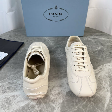 PRADA 25S MONTECARLO ANTIQUED SNEAKERS IN CHALK WHITE NAPPA LEATHER