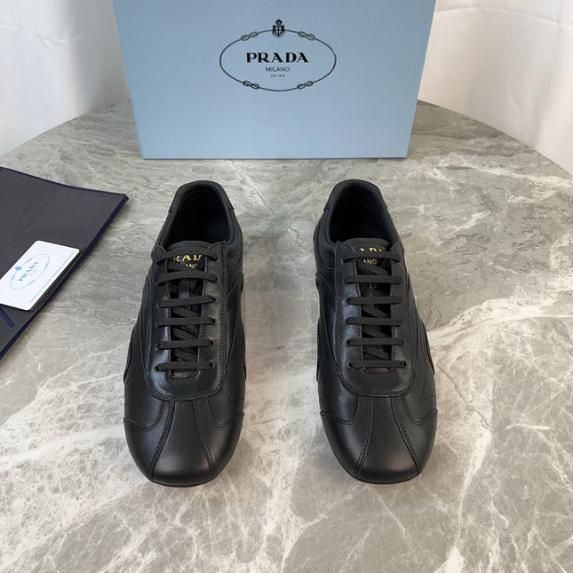 PRADA 25S MONTECARLO ANTIQUED SNEAKERS IN BLACK NAPPA LEATHER