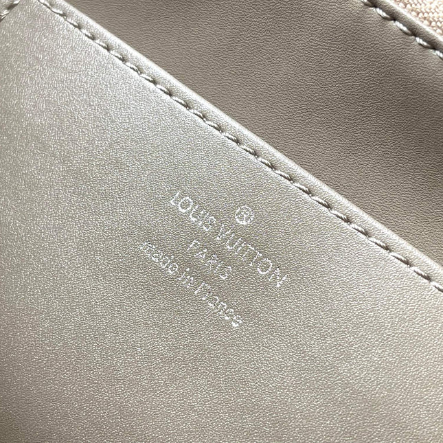 CAPUCINES SOUPLE GM 38 IN WHITE CANVAS AND TAUPE CALFSKIN TRIM