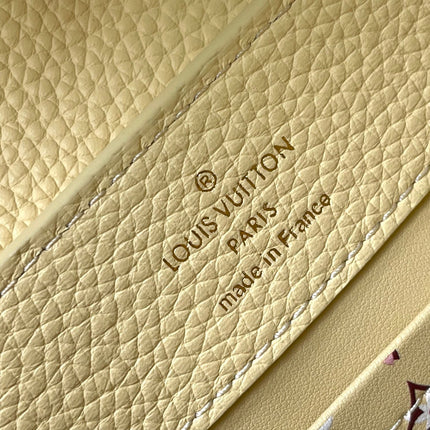 CAPUCINES EAST-WEST MINI 22 IN BANANA YELLOW TAURILLON GOLD HARDWARE