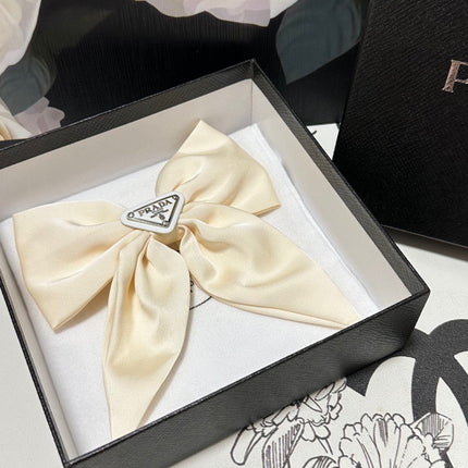 BOW-KNOT HAIR CLIP IN EGG SHELL SILK 358294