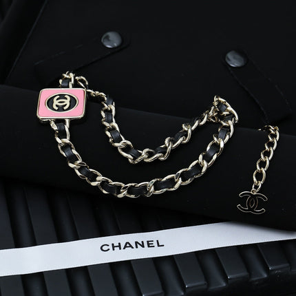 CHAIN CHOKER IN GOLD-PLATED METAL WITH  LEATHER THROUGH LINKS