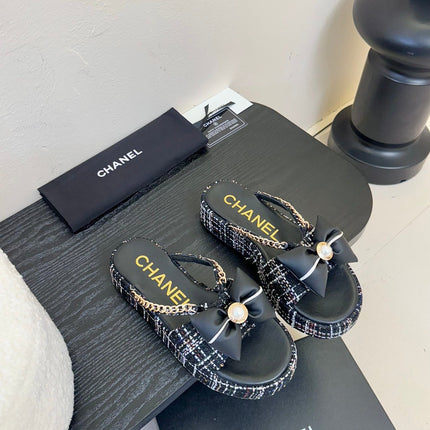 PLATFORM FLIP-FLOPS IN BLACK TWEED FABRIC