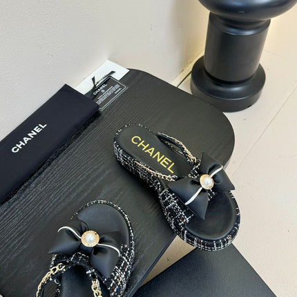 PLATFORM FLIP-FLOPS IN BLACK TWEED FABRIC